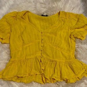 Yellow ruffled blouse